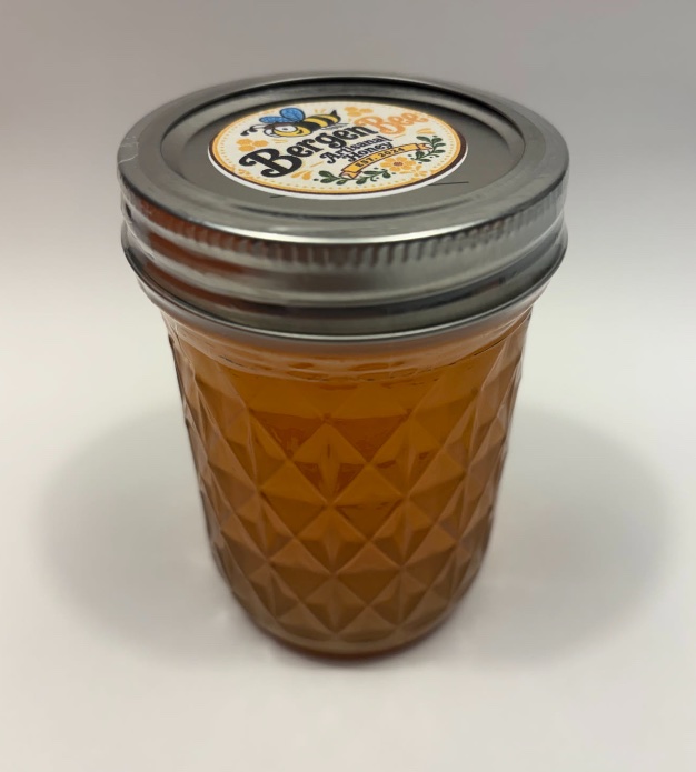 Eight-ounce artisanal honey in an American-made Ball glass jar with a Bergen Bee label on the lid